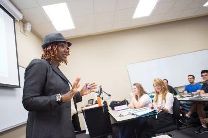 a professor lectures in front of a class